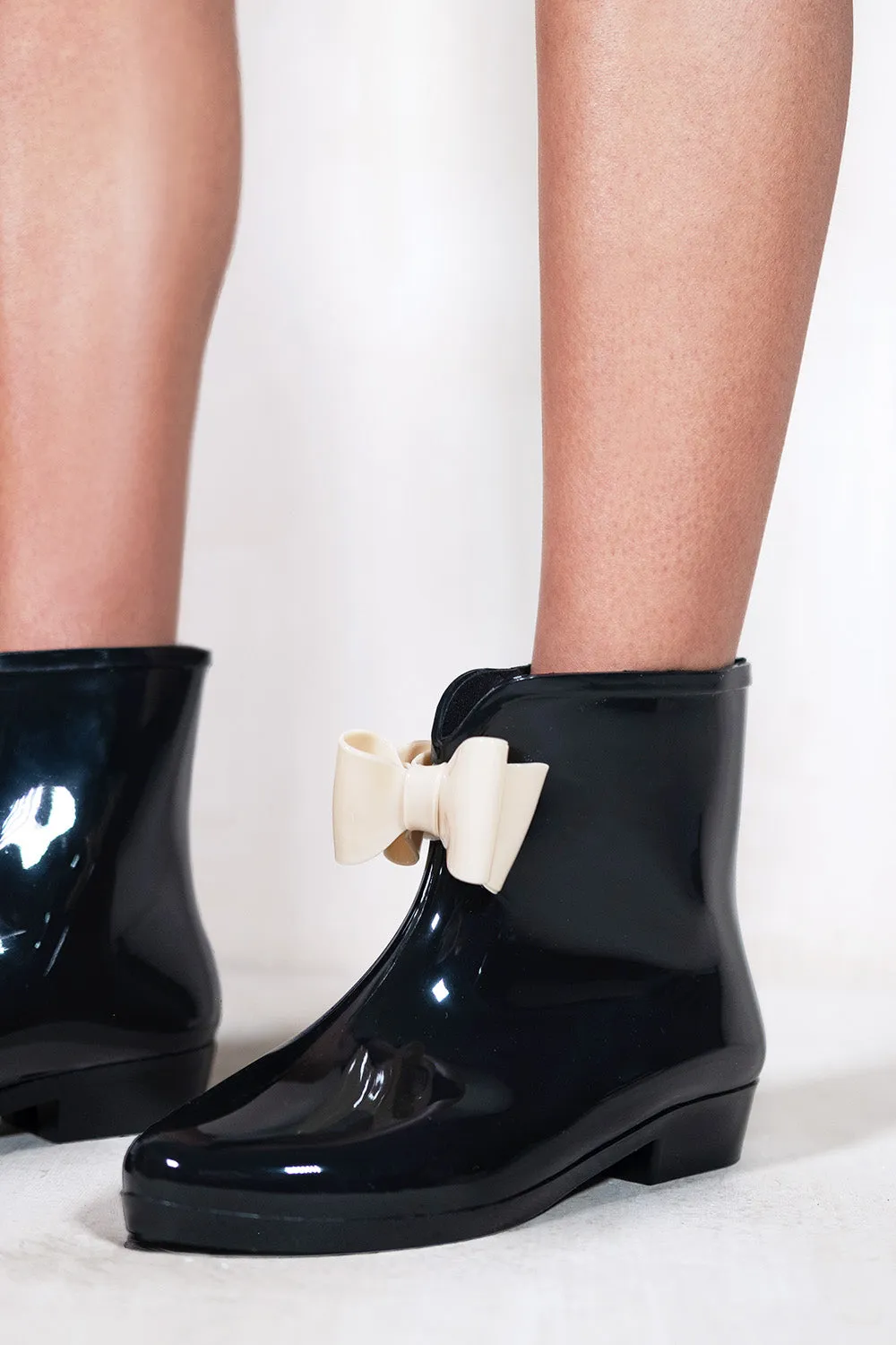 TRISH  LOW HEEL ANKLE WELLIES WITH NUDE BOW IN BLACK PATENT FAUX LEATHER